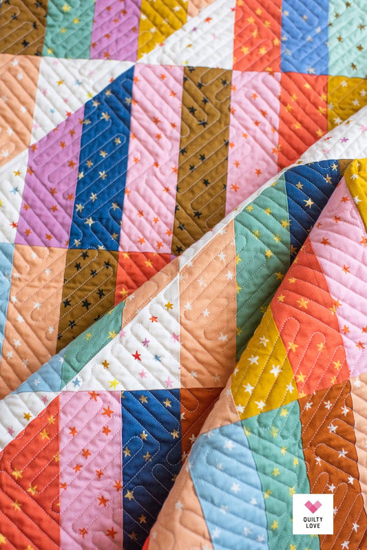 Colorful quilt with star patterns in various colors