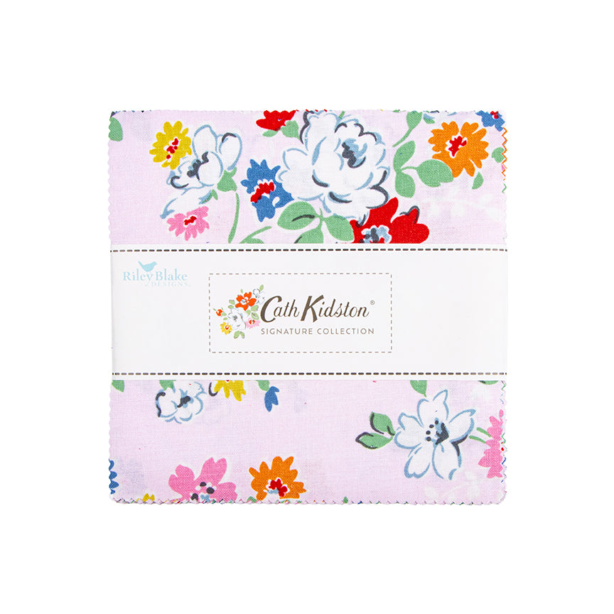 A folded piece of Riley Blake Cath Kidston Signature Collection fabric with a light pink background and a colorful floral print, wrapped in a white paper band.