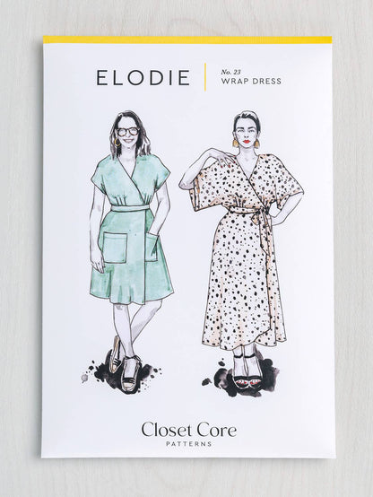 Elodie wrap dress pattern packaging with illustrations of two women wearing dresses, on a light gray background.