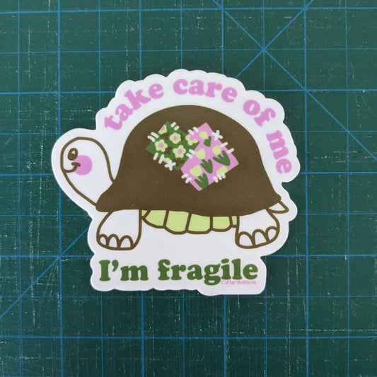 Sticker of a turtle with flowers in its shell on a grid background