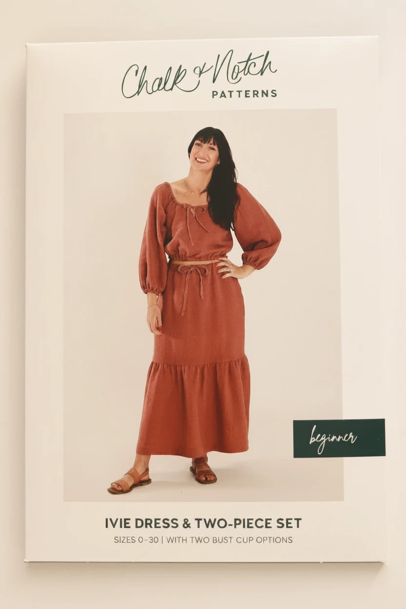 Chalk & Notch Patterns sewing pattern envelope for the Ivie Dress and Two-Piece Set, featuring a model wearing a rust-colored maxi dress on the front cover.