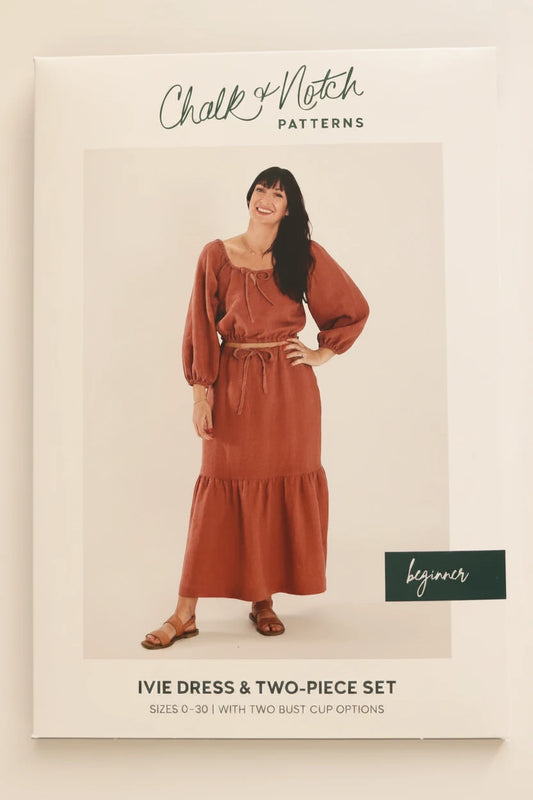 Chalk & Notch Patterns sewing pattern envelope for the Ivie Dress and Two-Piece Set, featuring a model wearing a rust-colored maxi dress on the front cover.