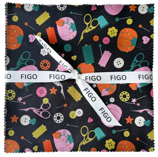 A square fabric square with scalloped edges, featuring a colorful sewing and crafting pattern on a black background, tied with a white Figo ribbon.